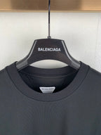Crewneck T-shirt neckline with brand hang tag and interior neck label