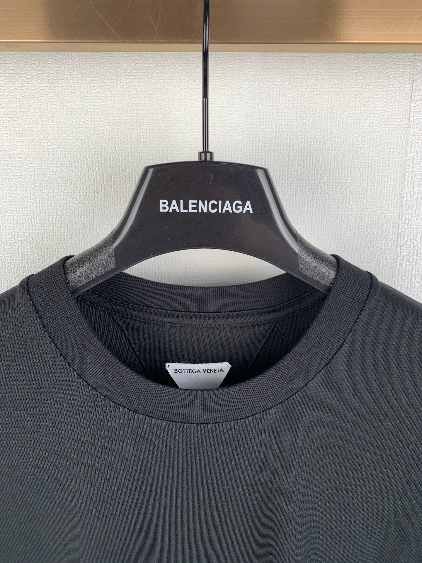 Crewneck T-shirt neckline with brand hang tag and interior neck label