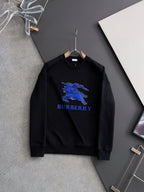 Black sweatshirt with blue horse graphic and BURBERRY logo on the chest.