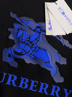 Black sweatshirt fabric with large blue horse graphic and partial BURBERRY text.