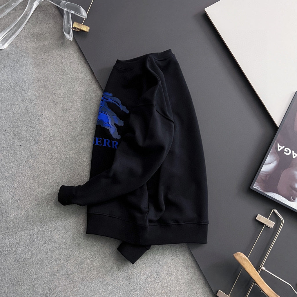 Black sweatshirt side/back view with partial blue horse graphic and tag.