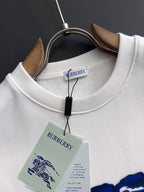 White long-sleeve sweatshirt with ribbed crew neck and hanging Burberry label