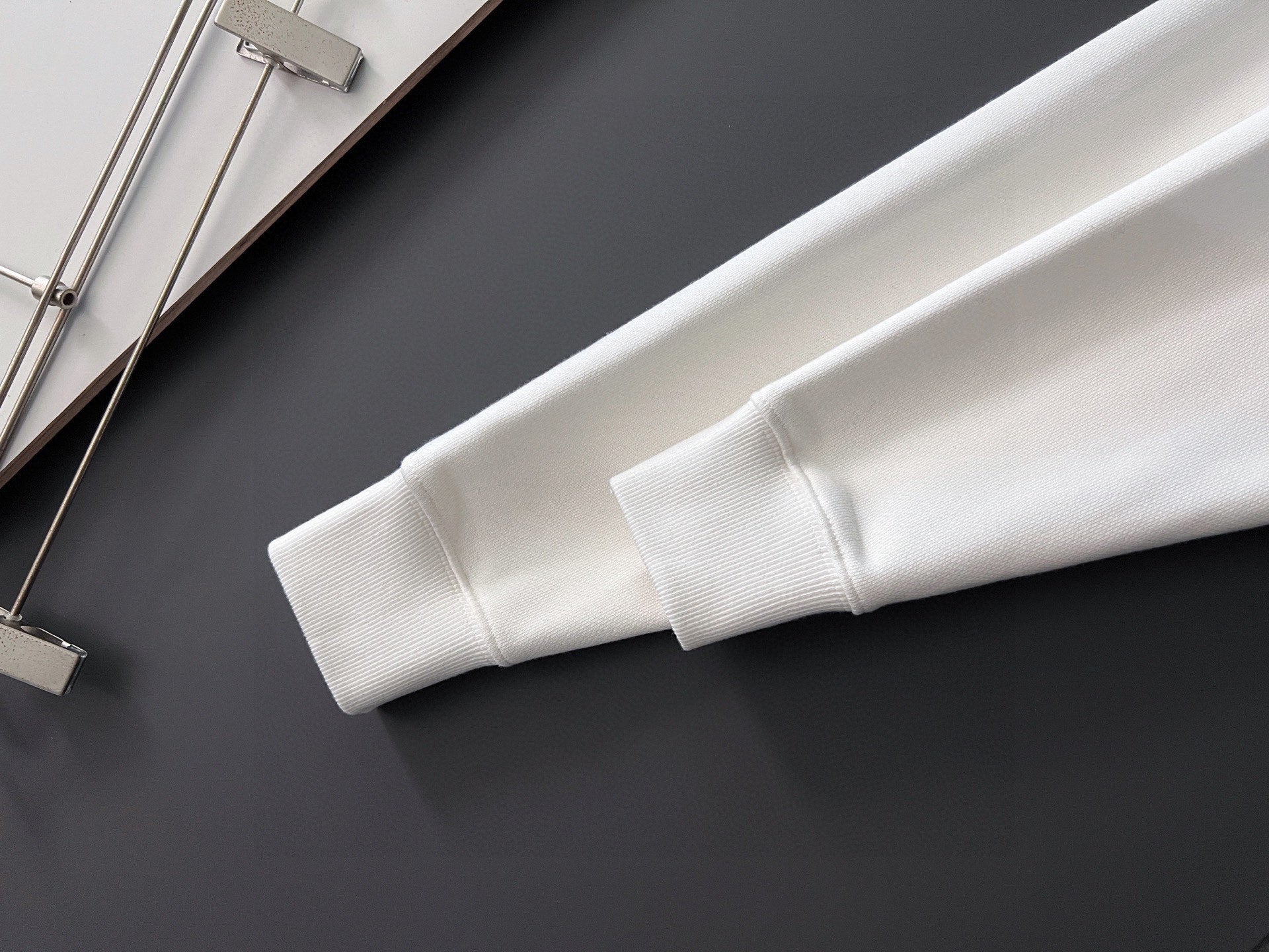 White sweatshirt sleeve cuff with ribbed hem