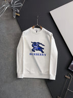 White long-sleeve sweatshirt with blue horse-and-text Burberry logo on chest