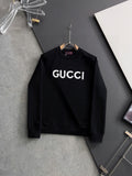 Black Gucci crewneck sweatshirt with white “GUCCI” logo lettering