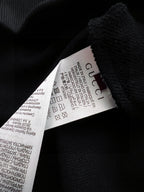 Black Gucci sweatshirt interior label on textured knit fabric