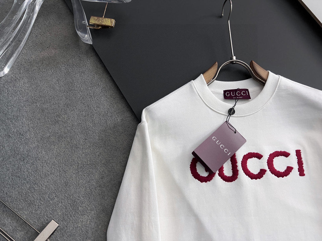 White Gucci long-sleeve sweatshirt with oversized red GUCCI logo, crew neck