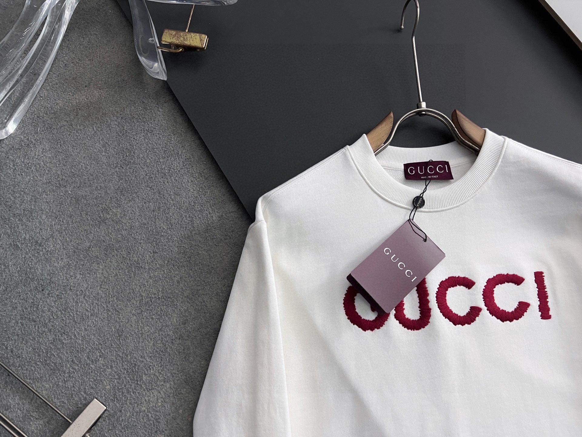 White Gucci long-sleeve sweatshirt with oversized red GUCCI logo, crew neck