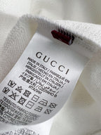 White sweatshirt inside neck with GUCCI fabric label and care text