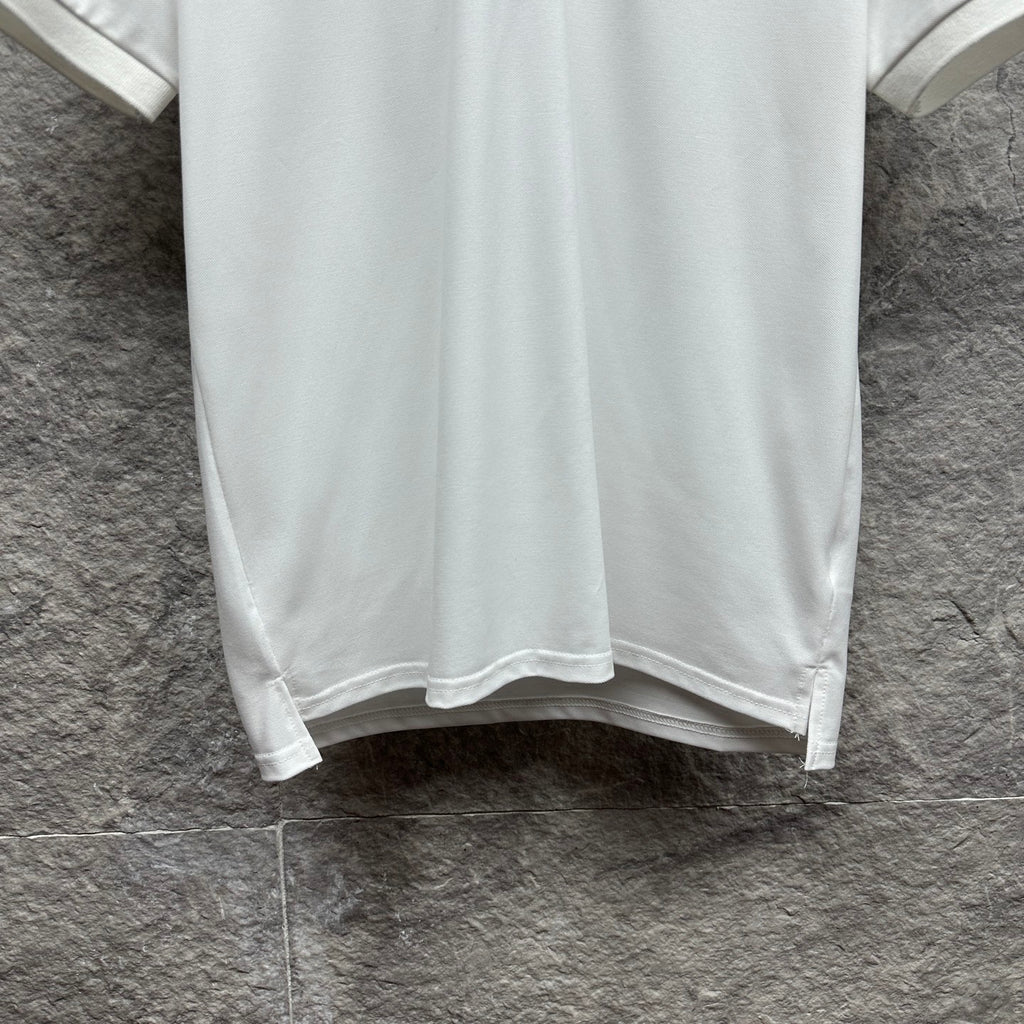Gucci short-sleeve polo shirt hem, white with straight bottom edge.