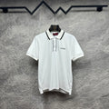 Gucci short-sleeve polo shirt, white with black-trim placket and chest logo.