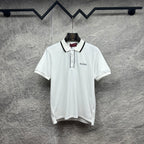 Gucci short-sleeve polo shirt, white with black-trim placket and chest logo.
