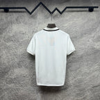 Gucci short-sleeve polo shirt, white back view with black-trim collar.