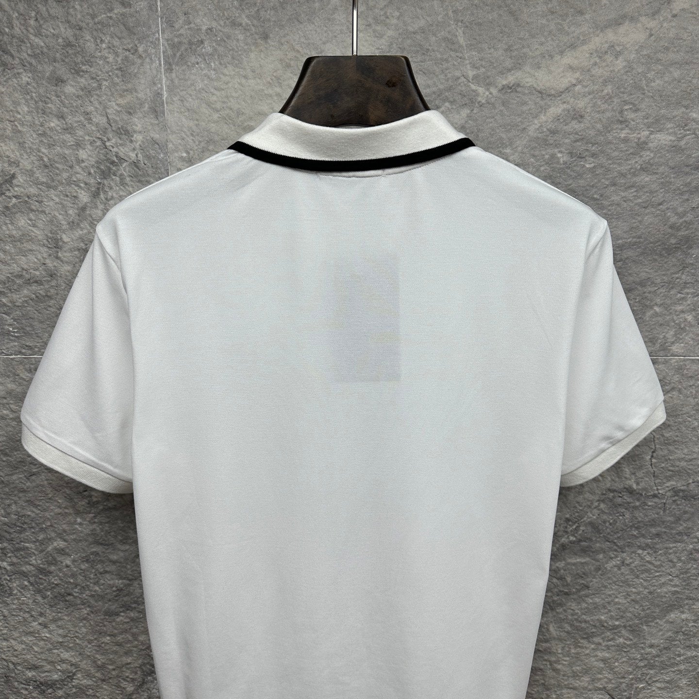 Gucci short-sleeve polo shirt, white back with black-trim collar.