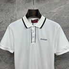 Gucci short-sleeve polo shirt, white front with black-trim collar and chest logo.