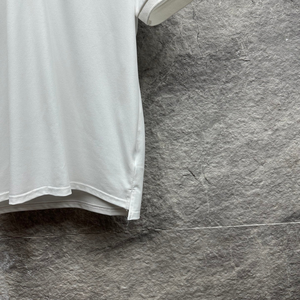 Gucci short-sleeve polo shirt, white lower side with hemline.