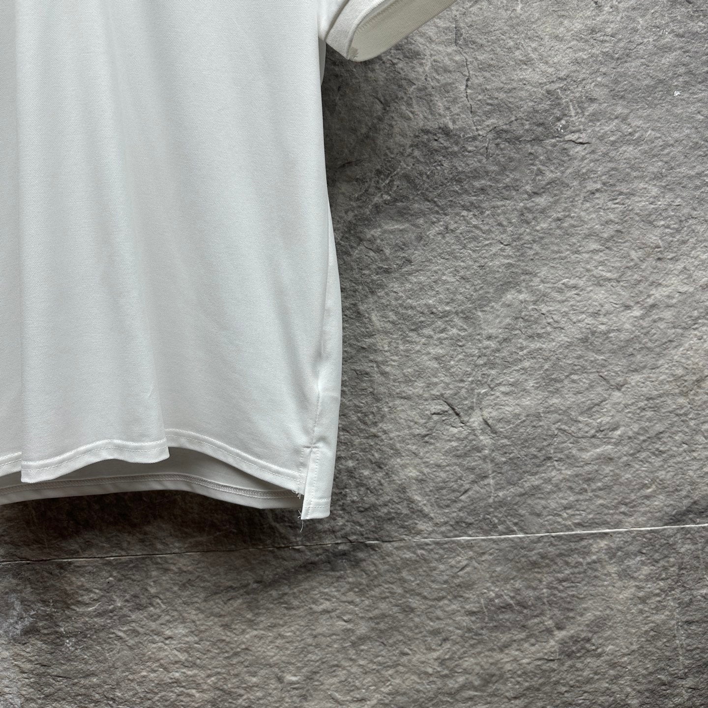 Gucci short-sleeve polo shirt, white lower side with hemline.