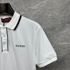 Gucci short-sleeve polo shirt, white with black-trim collar and small chest logo.