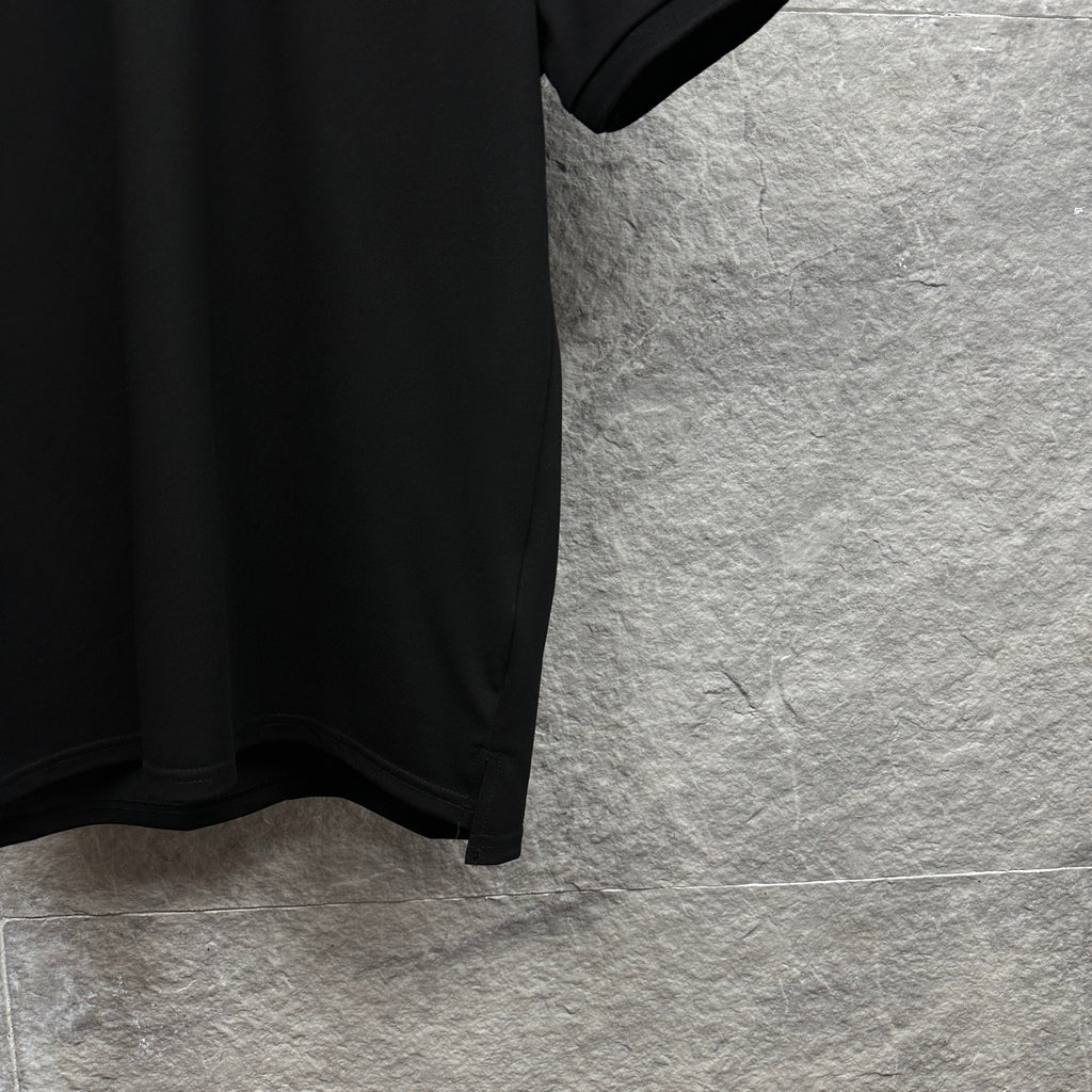 Black polo shirt sleeve and hem with side slit