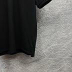 Black polo shirt sleeve and hem with side slit
