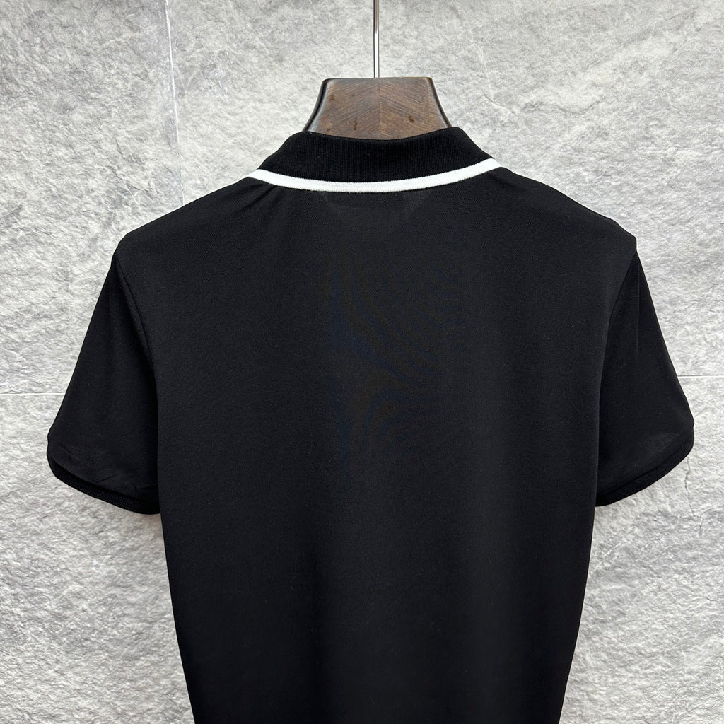 Black polo shirt back view with white collar trim
