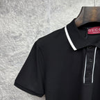 Black polo shirt collar and shoulder with white trim and Gucci label