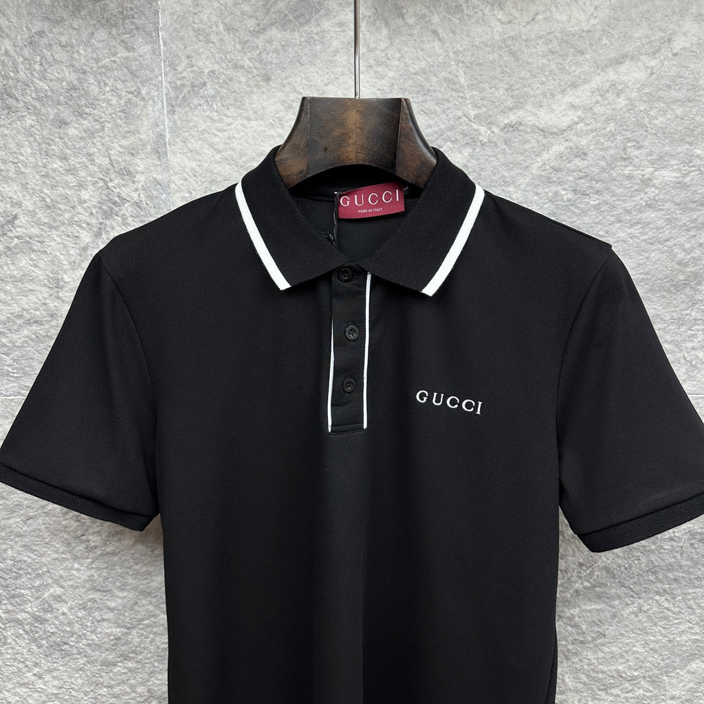 Black polo shirt close-up with white collar trim, button placket, and Gucci