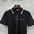 Black polo shirt close-up with white collar trim, button placket, and Gucci