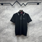 Black polo shirt with white collar trim, button placket, and Gucci logo
