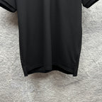 Black polo shirt hem with side slit detail