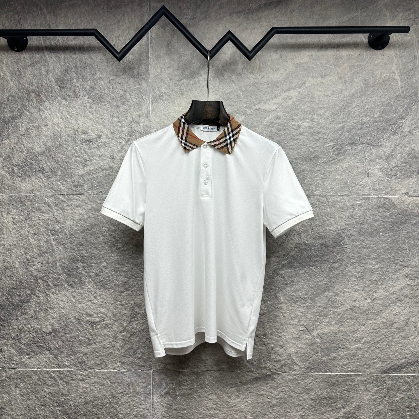 Burberry white polo shirt with checkered plaid collar and button placket