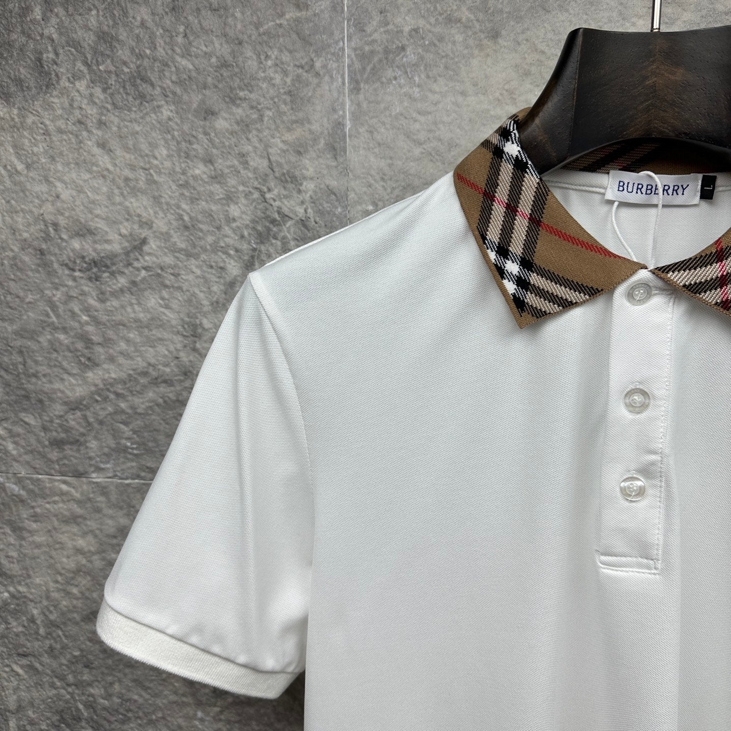 Burberry white polo shirt with plaid collar trim and button placket detail
