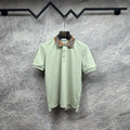 Mint green polo shirt with check-trim collar and button placket