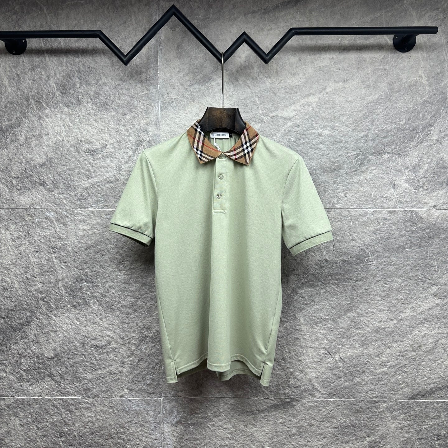 Mint green polo shirt with check-trim collar and button placket