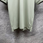 Mint green polo shirt hem with curved bottom and side seams