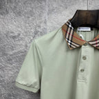 Mint green polo shirt with check collar detail and two-button placket