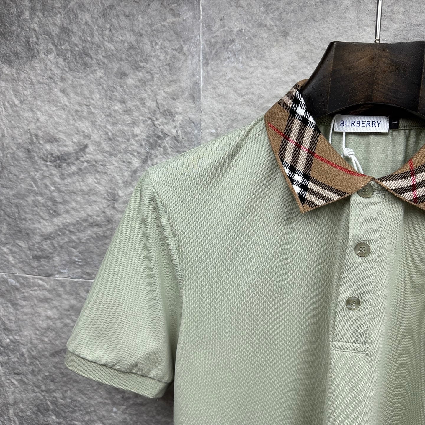Mint green polo shirt with check collar detail and two-button placket