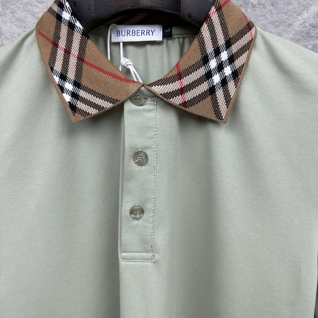 Mint green polo shirt close-up: check collar and button placket