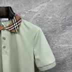 Mint green polo shirt sleeve with check collar edge and button placket