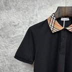 Burberry polo shirt close-up, black with tartan check collar and button placket