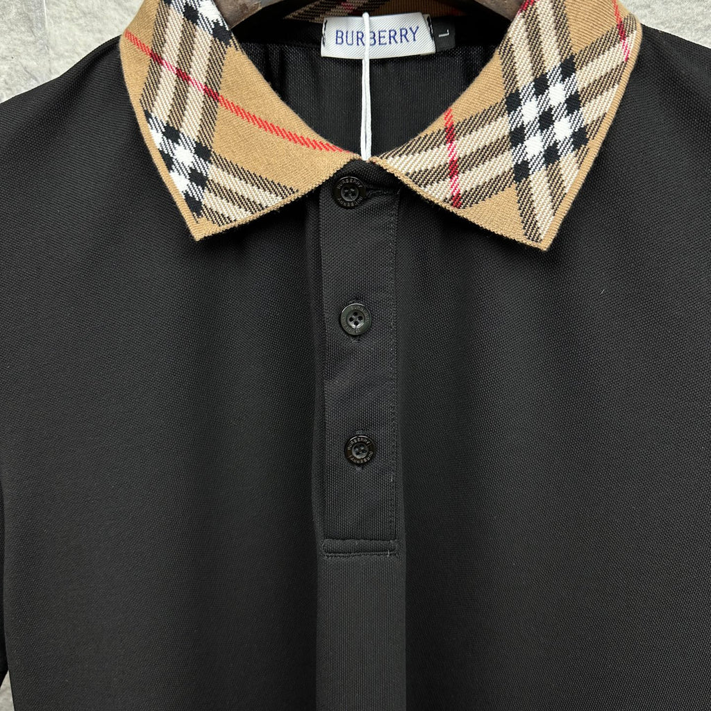 Burberry polo shirt close-up: tartan check collar and button front, black