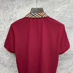 Maroon short-sleeve polo shirt, back view with check collar trim.