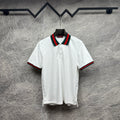 Gucci white polo shirt with green and red striped collar, short sleeves.