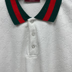Gucci white polo shirt close-up with green-red striped collar and button placket.