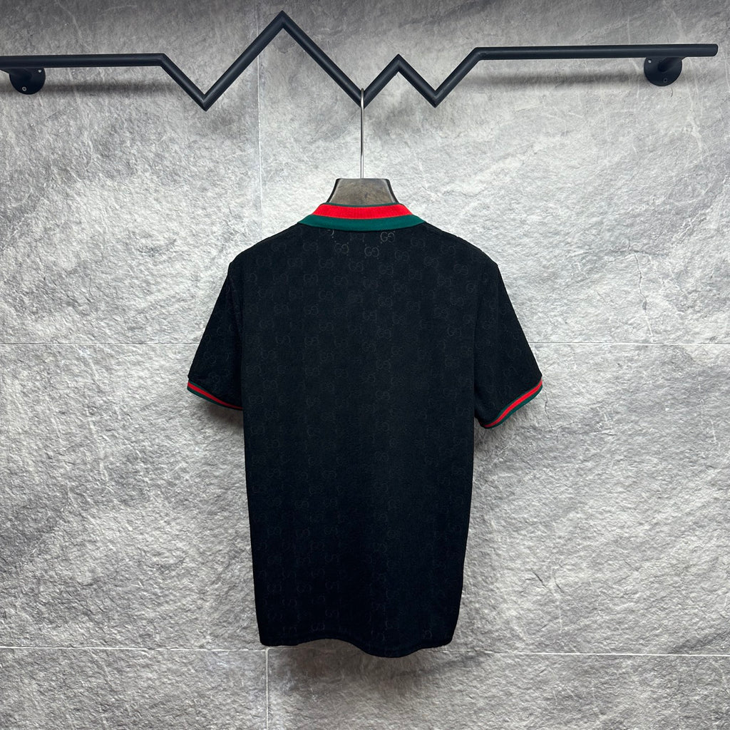 Gucci dark polo shirt, back view, with green-red striped sleeve and collar trim