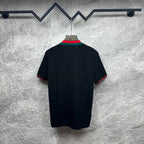 Gucci dark polo shirt, back view, with green-red striped sleeve and collar trim