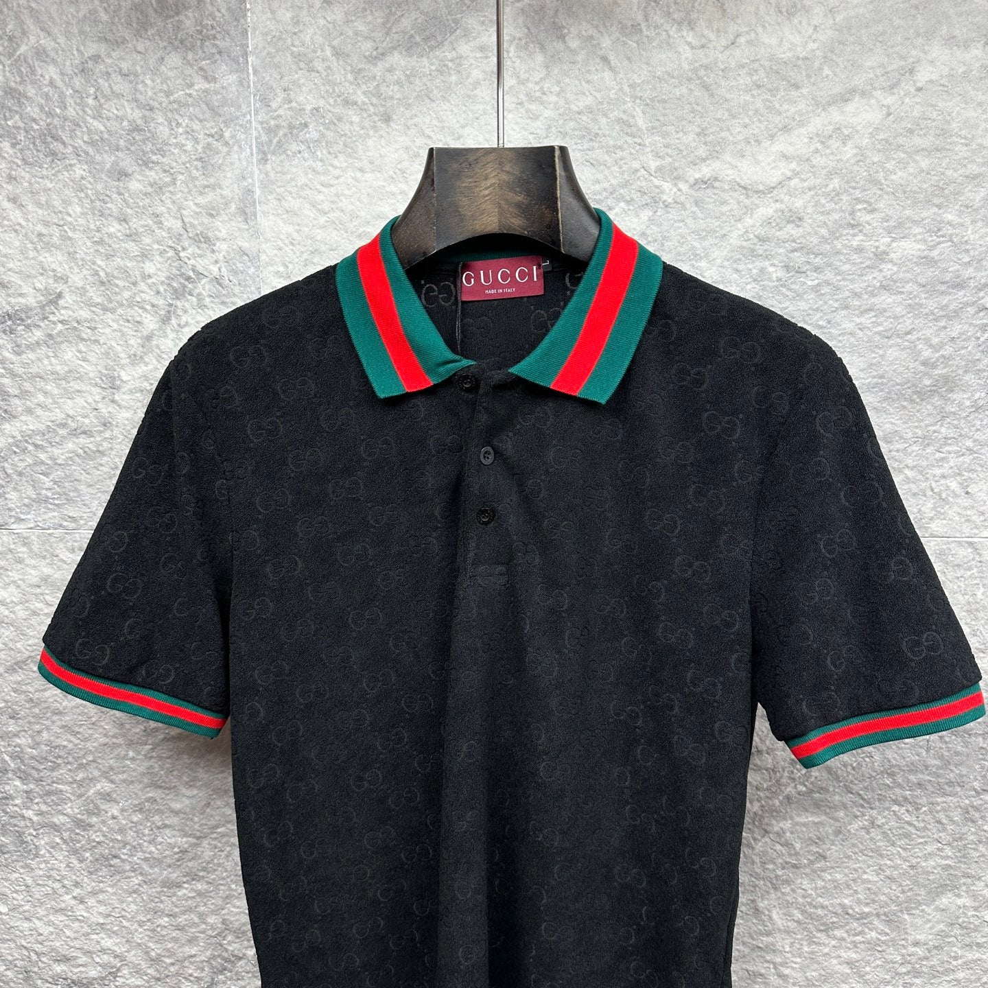 Gucci dark polo shirt with striped ribbed collar and button placket detail