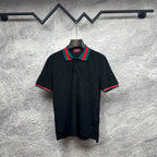 Gucci dark polo shirt with green-red striped collar and matching sleeve trim