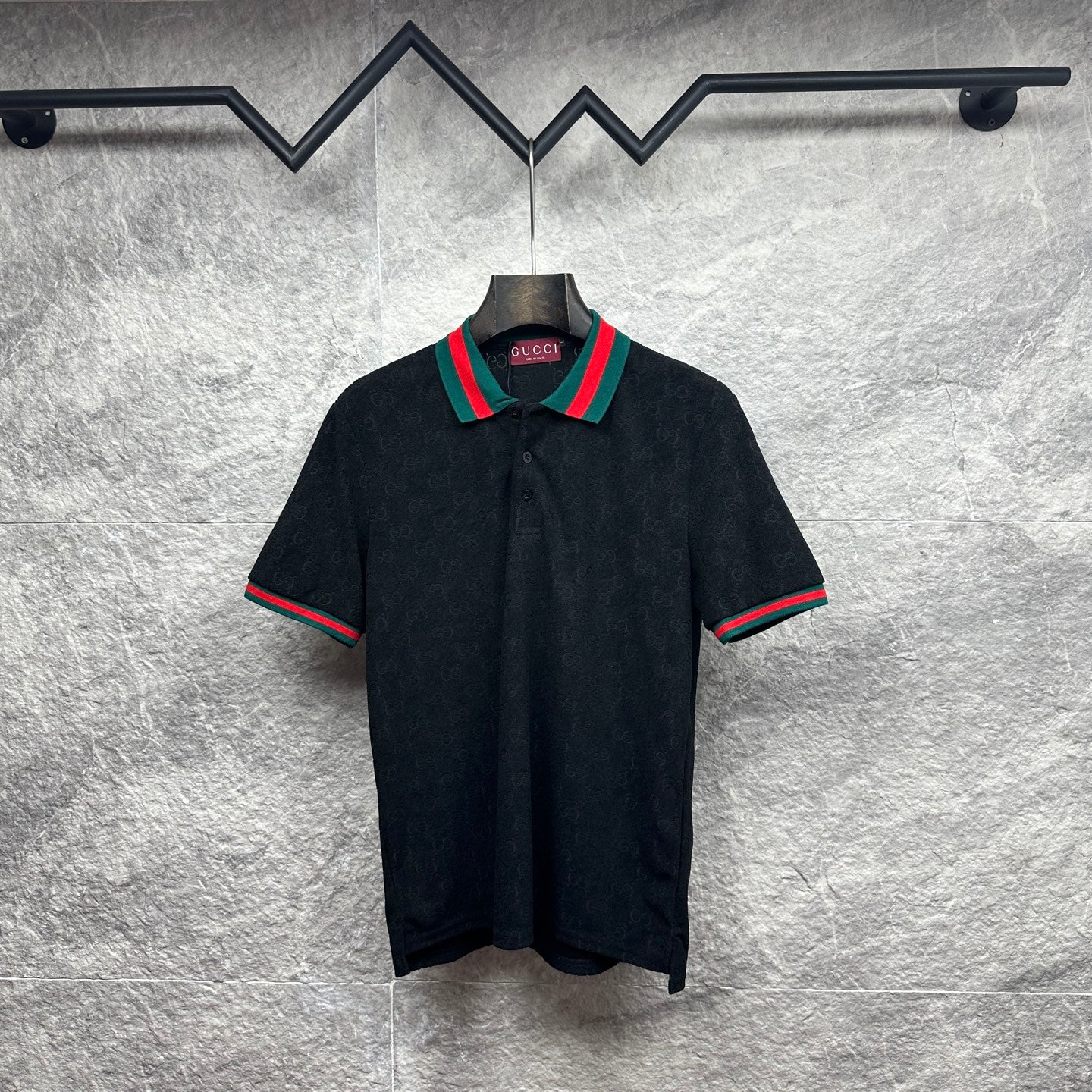 Gucci dark polo shirt with green-red striped collar and matching sleeve trim