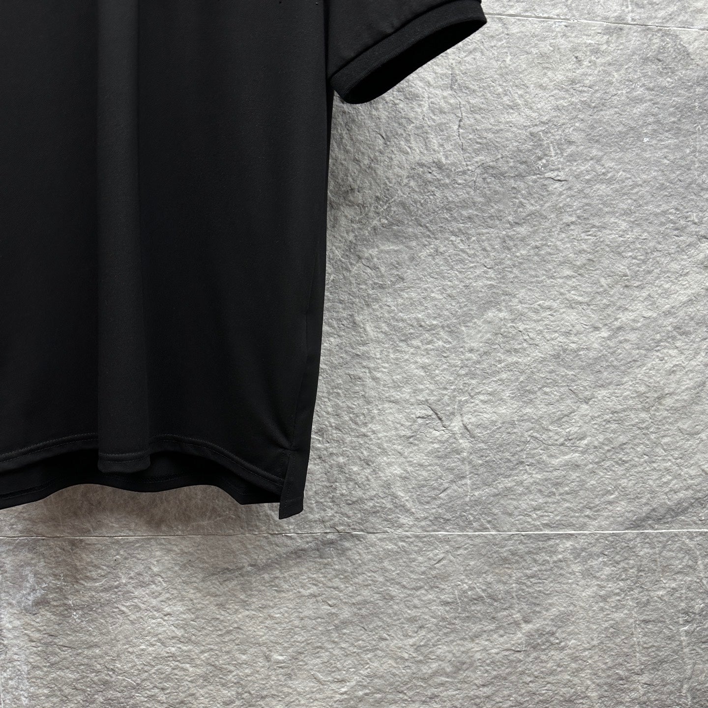 Black Gucci polo shirt side hem with short sleeve cuff